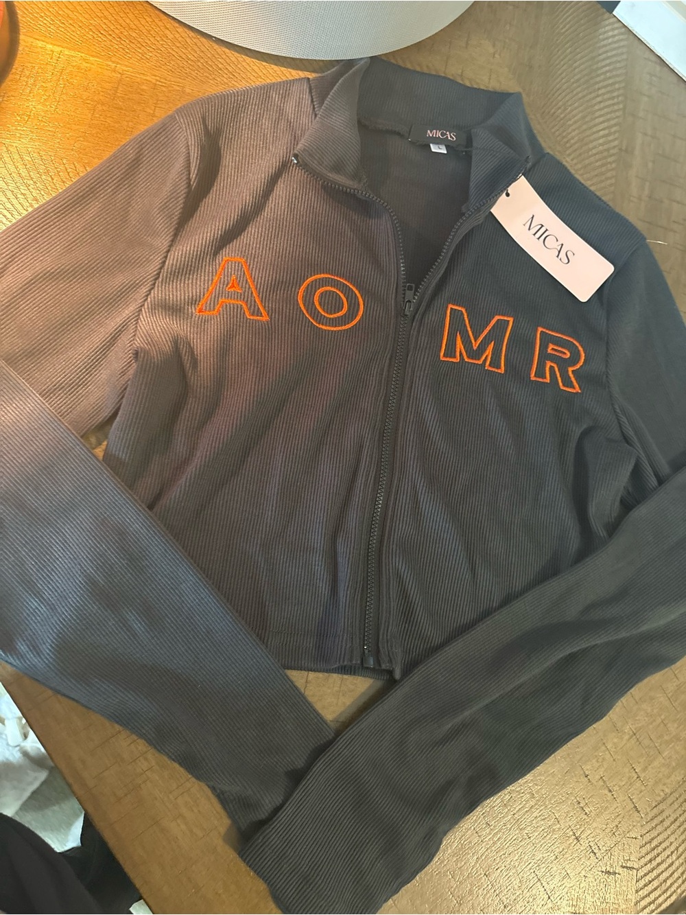 MICAS Charcoal Zip-Front Cropped Sweatshirt with Orange Lettering